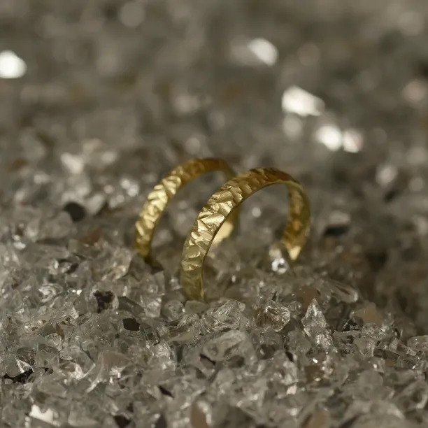 Gold wedding rings with a relief surface FIO Image