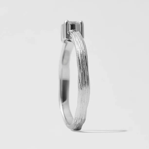 Side view of the BRITTANY gold engagement ring with textured band