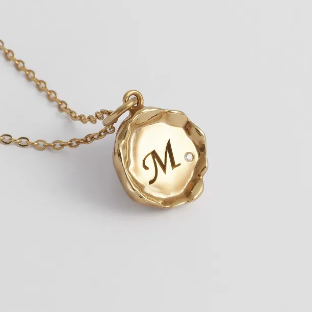 Angled close-up of the COLETTE personalised diamond pendant