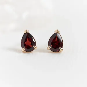 CARLIE gold earrings with pear-shaped garnets, shown as a matching pair
