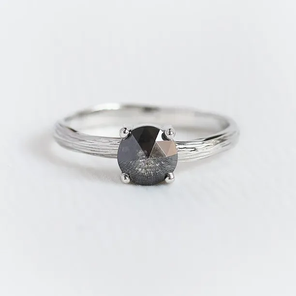 AURALIS engagement ring with salt and pepper diamond, close-up of twig-style band