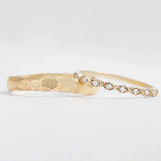 Side-by-side detail of DARLING wedding bands with diamonds and textured finish