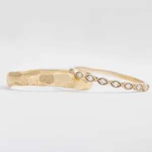 Side-by-side detail of DARLING wedding bands with diamonds and textured finish