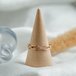 Gold diamond twisted ring shown in full