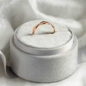 Side view of the gold diamond twisted ring