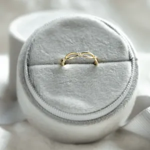 Gold diamond twisted ring in an angled display view
