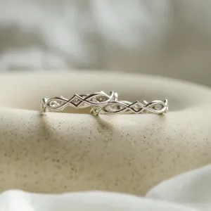 Two TARANIS rings displaying the interlaced Celtic design