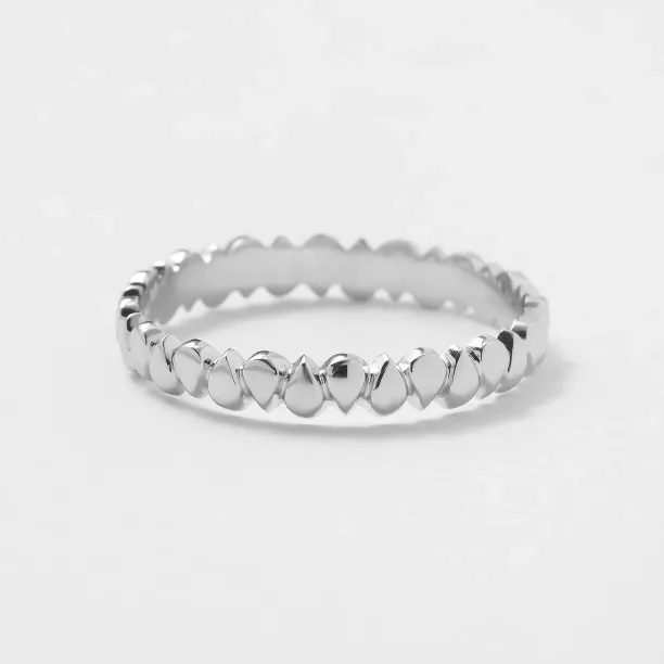 EIRA geometric wedding ring with a textured surface and repeating rounded forms