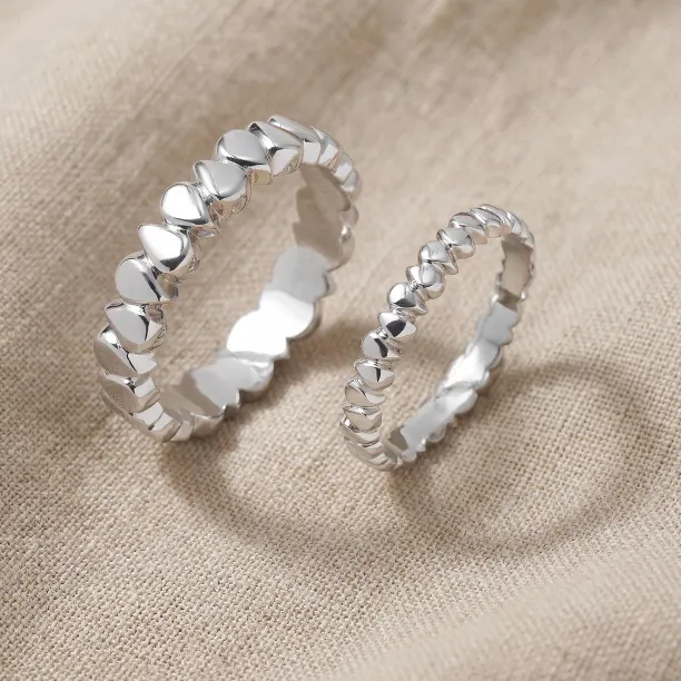 EIRA geometric wedding rings in white gold, shown in an angled pair view