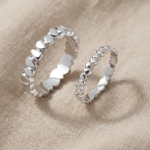 EIRA geometric wedding rings in white gold, shown in an angled pair view