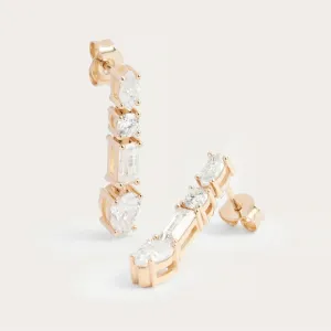 Angled view of MARINA dangle earrings with certified moissanites