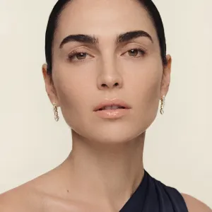 MARINA dangle moissanite earrings worn on both ears