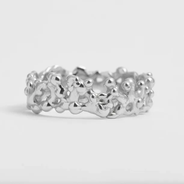 Front detail of a NALANI wedding ring with organic elements