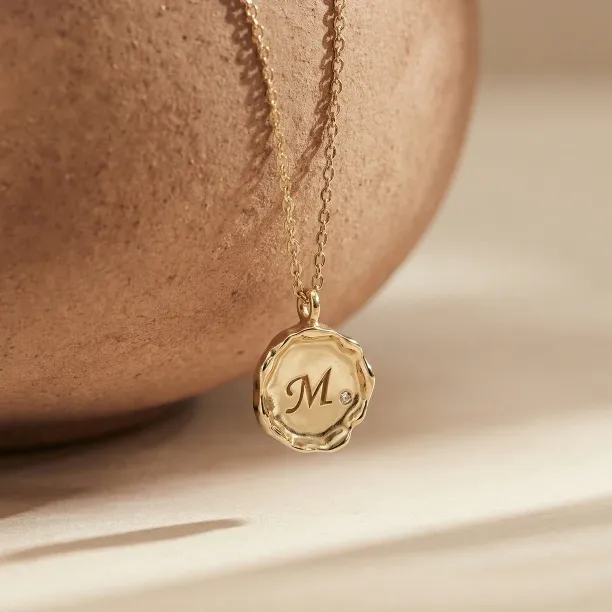 COLETTE personalised diamond necklace with engraved M pendant hanging freely
