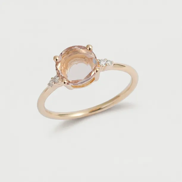 Angled view of the AUCKLAND gold ring showing its central stone and side diamonds