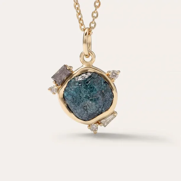 LAURA gold pendant with a raw diamond