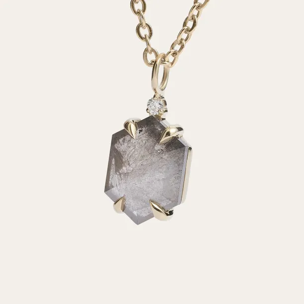 Angled close-up of the ARTIS art deco pendant with a salt and pepper diamond