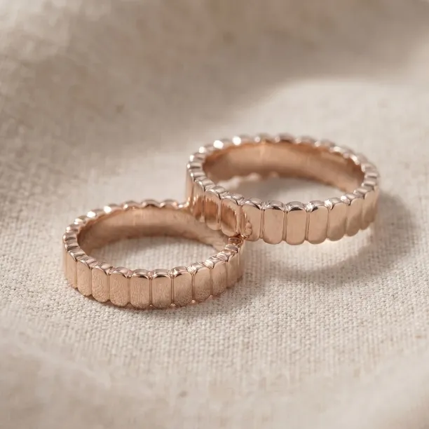 Pair of NERA geometric wedding rings in rose gold