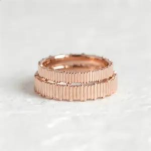 Stacked pair of VELA geometric wedding rings with textured bands