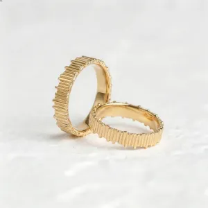 Yellow gold VELA wedding rings with textured vertical lines