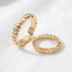 EIRA geometric wedding rings shown separately, highlighting their textured surfaces