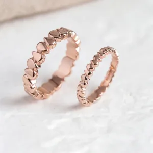 Pair of EIRA geometric wedding rings with repeating rounded forms