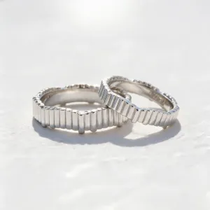 Geometric wedding rings INGRID shown together with their structured segmented surface