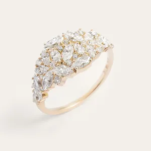 Angled view of the gold moissanite cluster ring and slim band