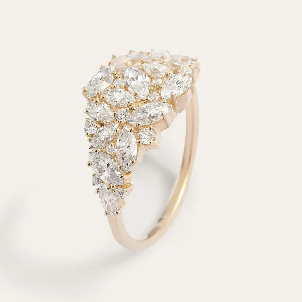 Side view of the gold moissanite cluster ring showing its slim band
