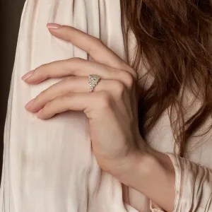 Gold moissanite cluster ring worn on the hand, close presentation