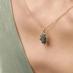 Close-up of the LAURA raw diamond pendant worn on the neck