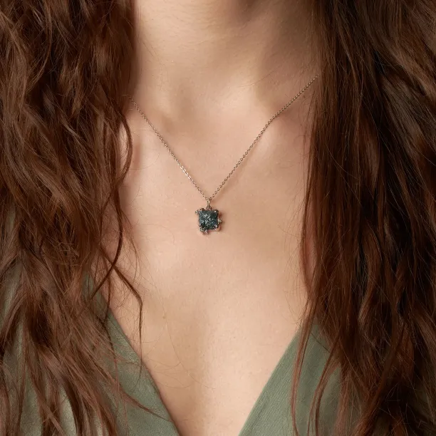 LAURA necklace with a raw diamond pendant worn on the neck