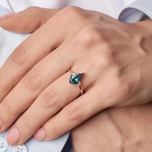 KATE ring with a lab-grown sapphire and moissanites worn on the hand