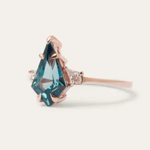 Angled view of the KATE ring with a lab-grown sapphire and moissanites