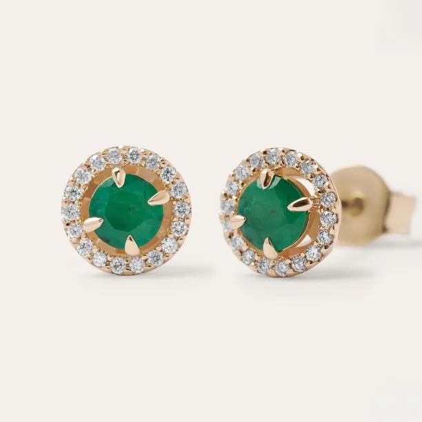 Close-up of MOLLY emerald and diamond earrings with one backing visible