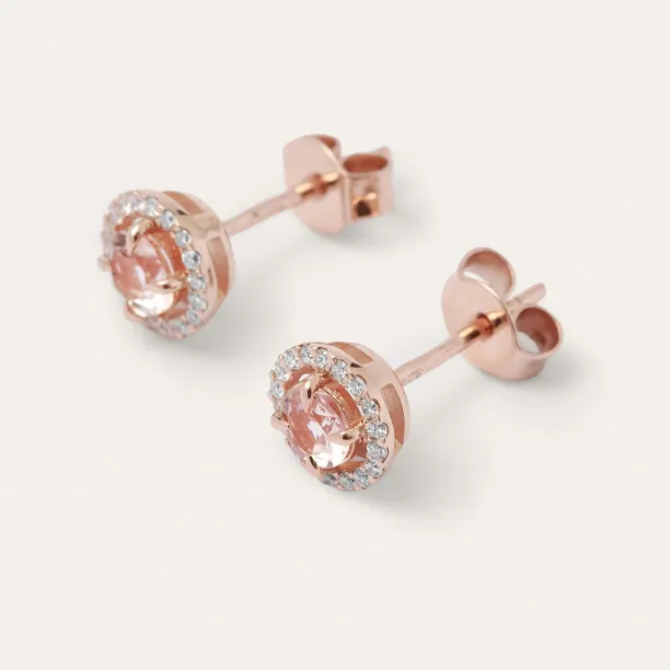 Angled view of NELLY gold stud earrings with morganites, diamonds and butterfly backs