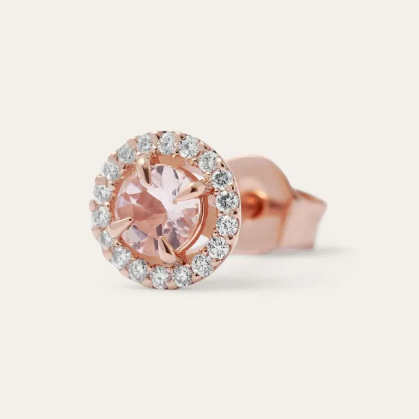 Close-up of one NELLY gold stud earring with a morganite and surrounding diamonds
