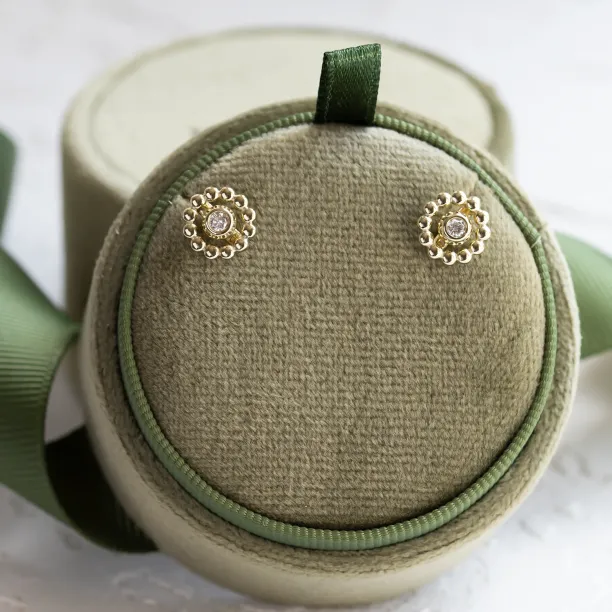 FLOS flower stud earrings displayed as a pair