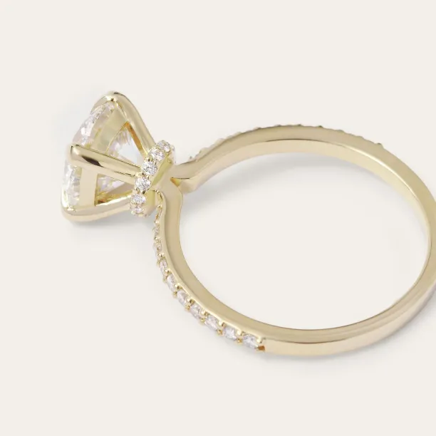 ARABELLA engagement ring side detail showing the central diamond setting and diamond-set band