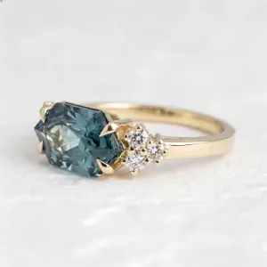 Angled close-up of the ARMINE gold ring with lab grown sapphire and diamonds