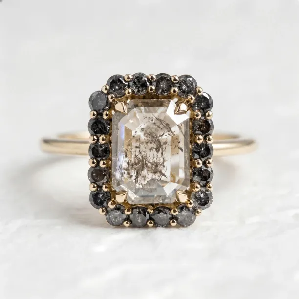 LUCIA emerald-shape salt and pepper diamond ring in gold with a halo setting