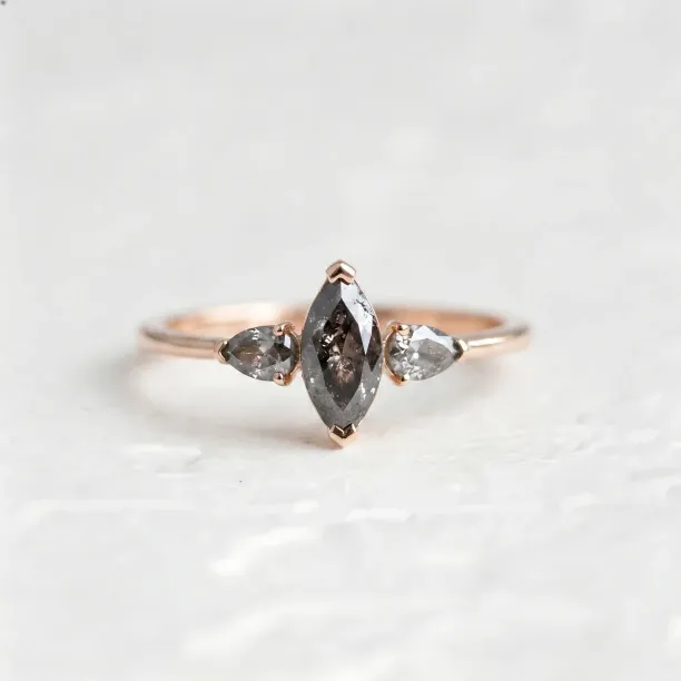 RHEA vintage engagement ring with a marquise and two pear-shaped salt and pepper diamonds