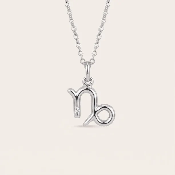 Gold diamond pendant CAPRICORN on a chain