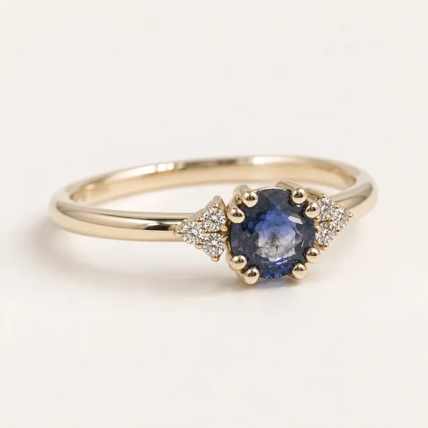 Gold ring with round sapphire and diamonds MONNY
